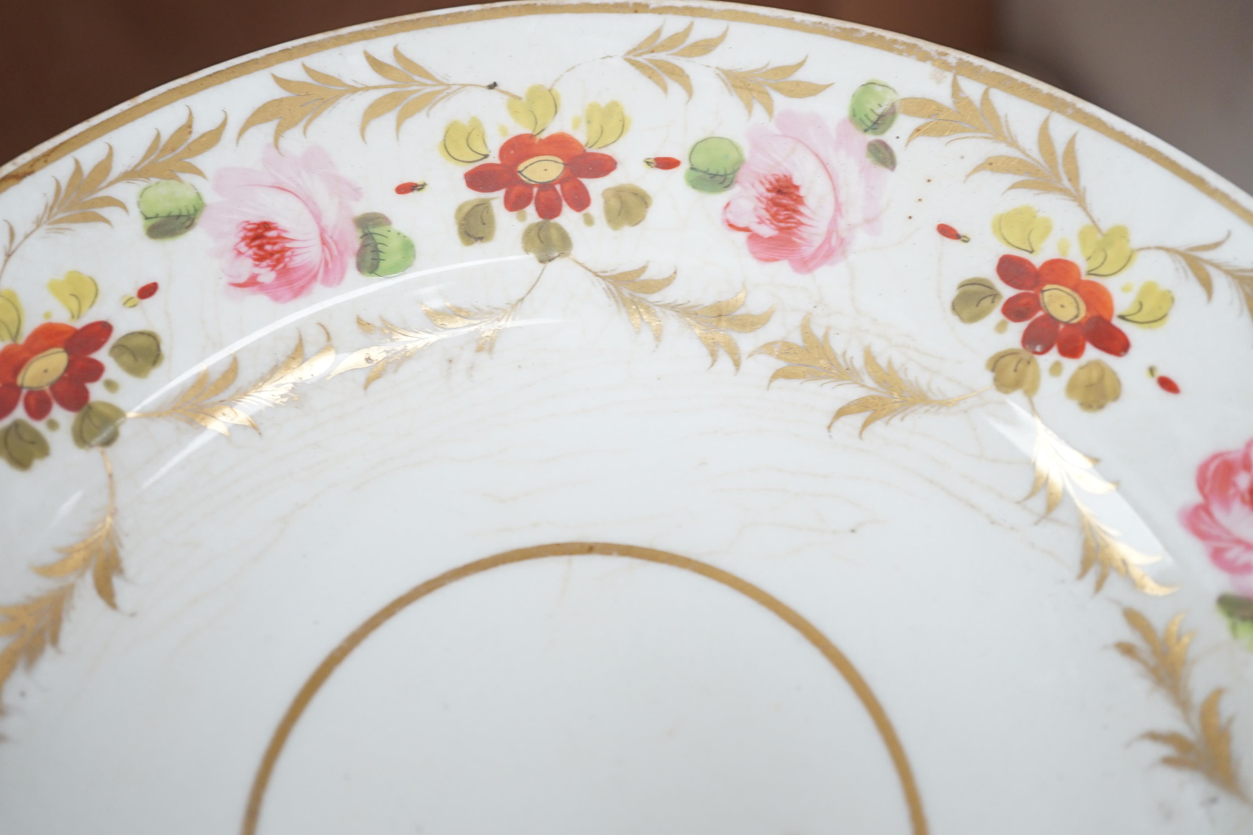 A sixteen piece Derby porcelain part dessert service, the borders painted with roses. Condition - some dishes and plates damaged or stained or crazed.